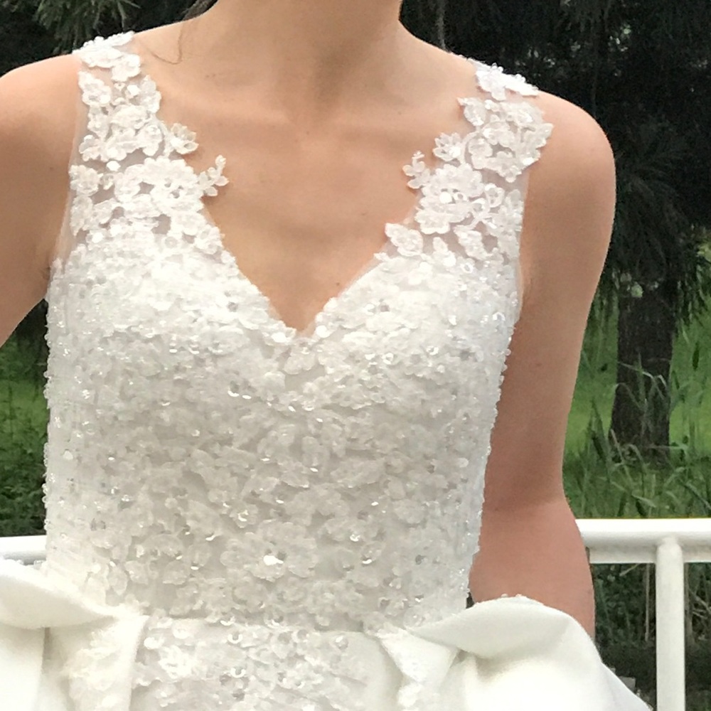 Sleeveless white wedding gown